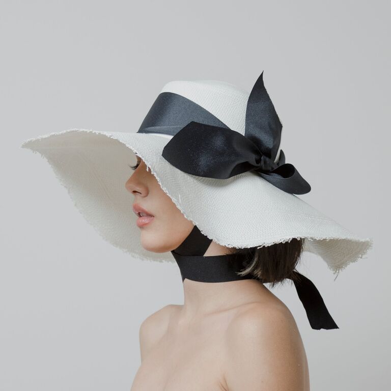 White wedding hat with black bow by Sensi Studios. 