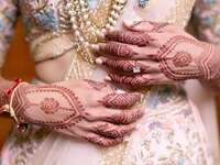 Bride with henna tattoos and short pink nails