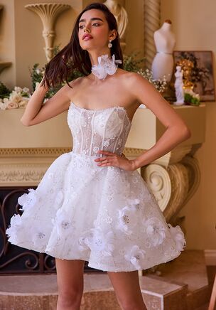 This enchanting A-line dress features a strapless scoop neckline and a voluminous tulle skirt adorned with delicate feather-beaded floral appliqués. The embellished tulle fabric adds a touch of whimsy, perfect for creating memorable moments. Ideal for a wedding reception, engagement photoshoot, or rehearsal dinner, this short dress brings graceful elegance to any celebration.