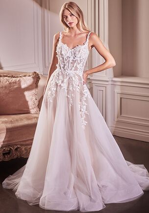 Step into a realm of enchantment with our ethereal A-line ball gown—a poetic symphony of romance and grace, designed to capture hearts and inspire dreams. Delicate straps adorned with intricate lace applique frame a mesmerizing sweetheart neckline, drawing the eye to the bodice's exquisite lace embellishments against a backdrop of nude lining. The layered ivory tulle skirt, cascading over nude lining, imparts an air of ethereal elegance and movement, evoking the spirit of a fairytale romance. Each delicate detail tells a story of timeless love and devotion, weaving a tapestry of enchantment that will linger in hearts for years to come. With its timeless beauty and graceful silhouette, this gown is not just attire—it's a testament to the enduring power of love, ready to accompany you on your journey towards forever.